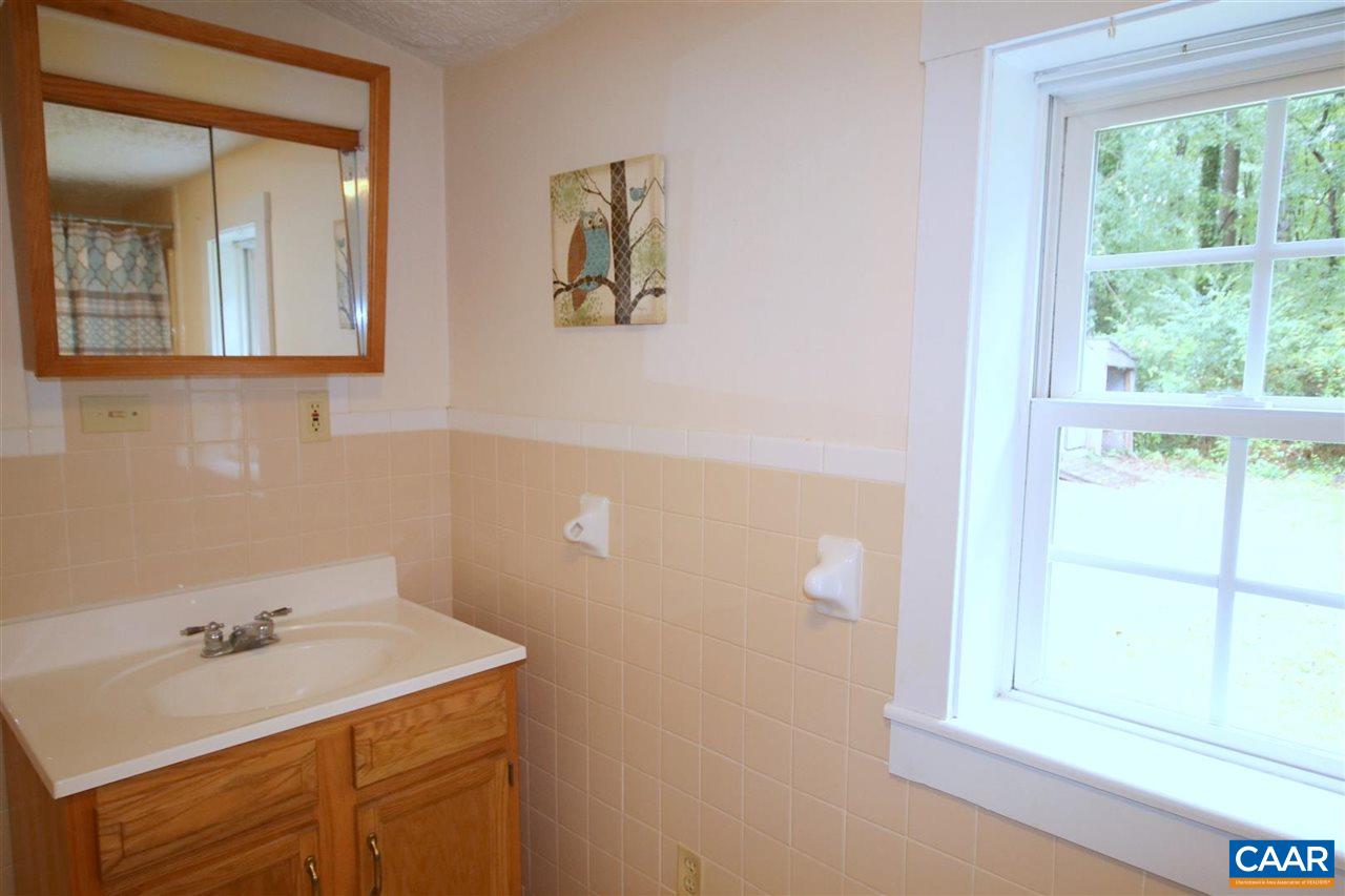 6773 Orange Road Orange, VA 22960 - Photo 19 of 31 a bathroom with a sink and a mirror