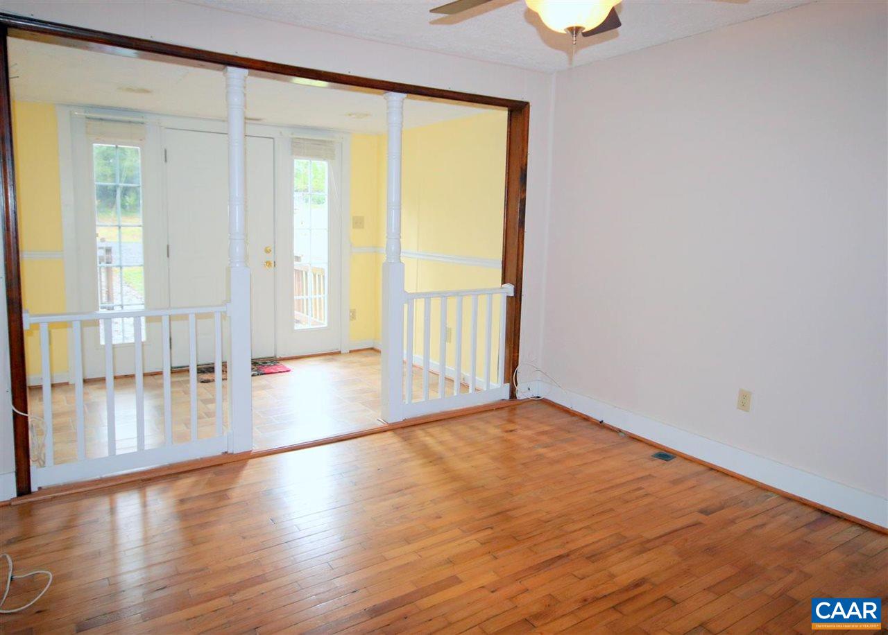 6773 Orange Road Orange, VA 22960 - Photo 6 of 31 a view of an empty room with wooden floor and a window