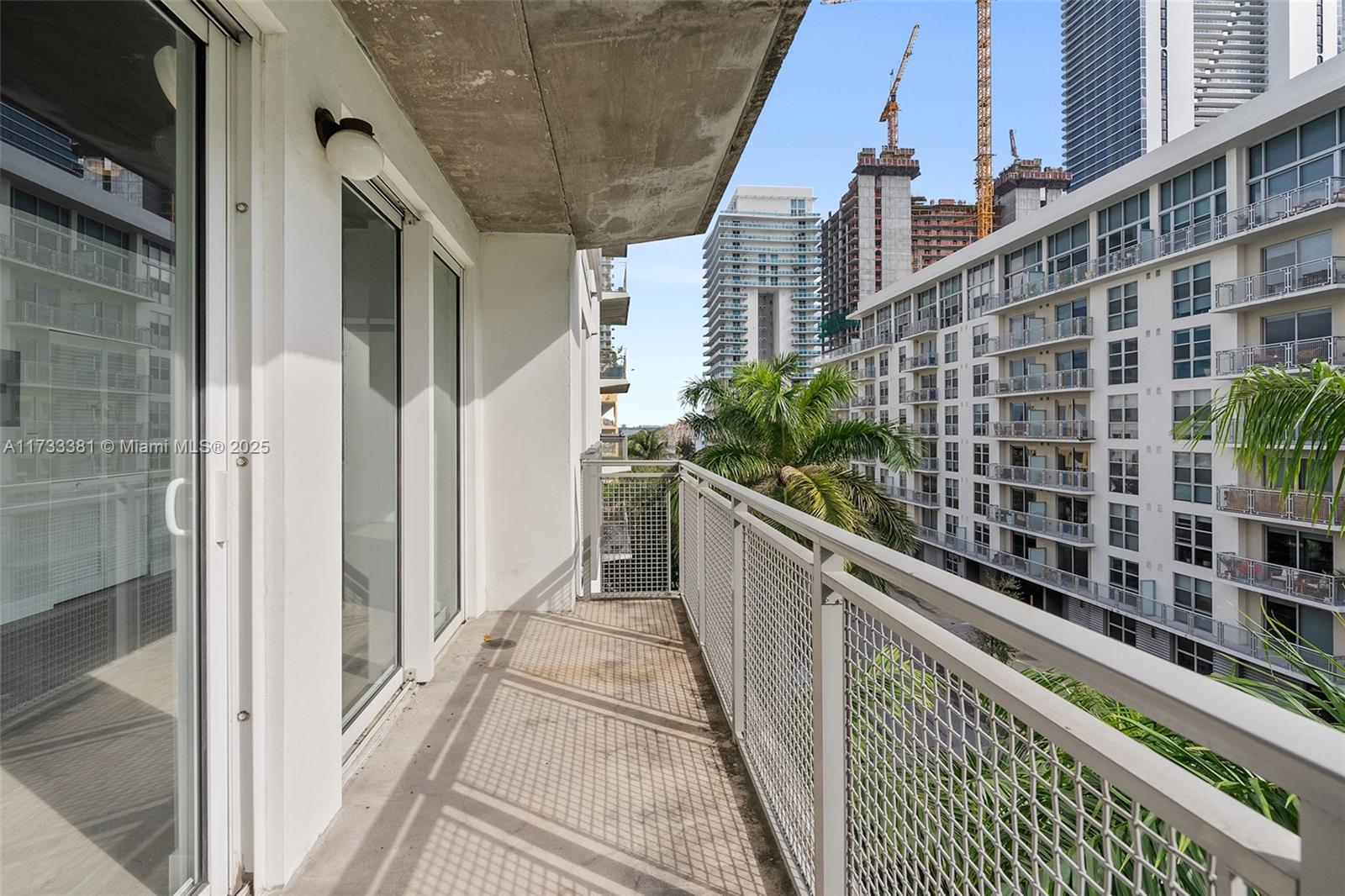 455 Northeast 25th Street, Unit 509 Miami, FL 33137 - Photo 16 of 30 a view of balcony with a potted plant