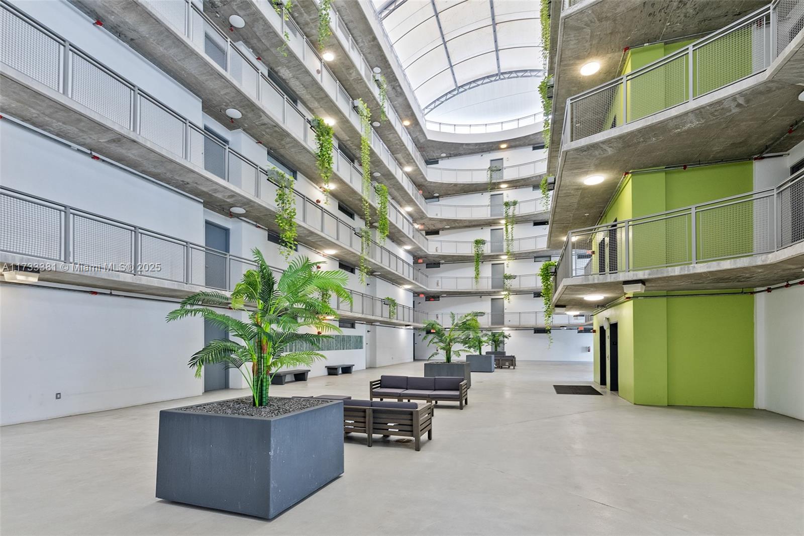 455 Northeast 25th Street, Unit 509 Miami, FL 33137 - Photo 19 of 30 a living room with furniture and a potted plant
