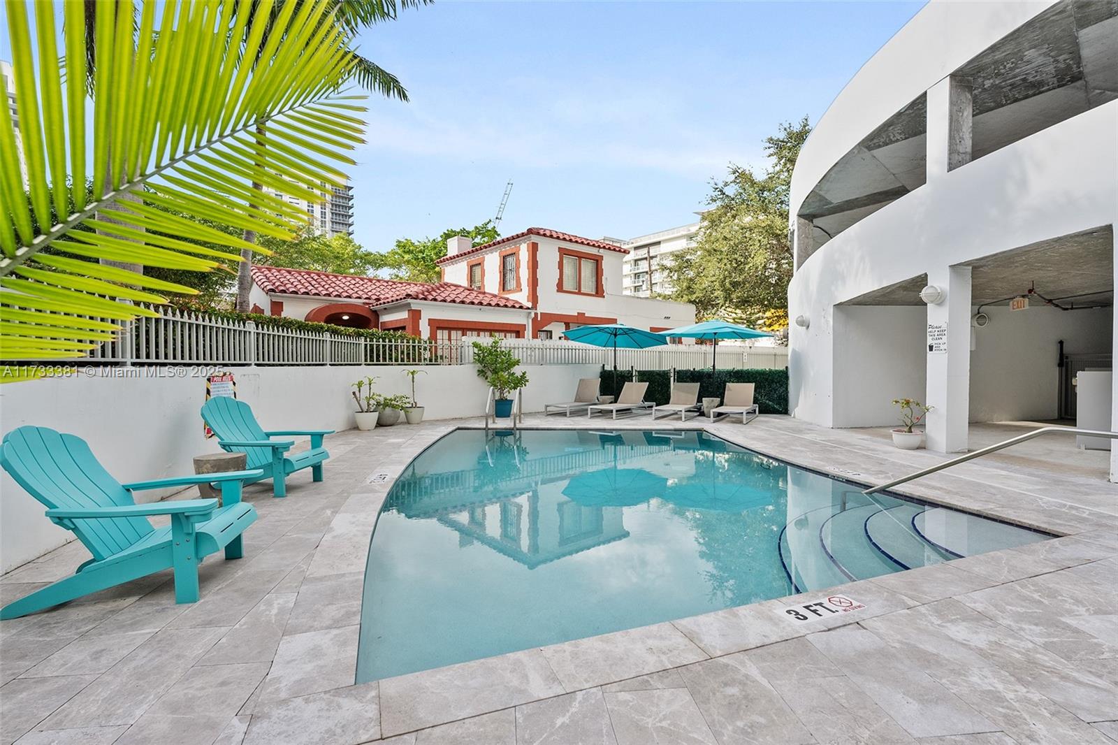 455 Northeast 25th Street, Unit 509 Miami, FL 33137 - Photo 2 of 30 a view of a patio with swimming pool table and chairs