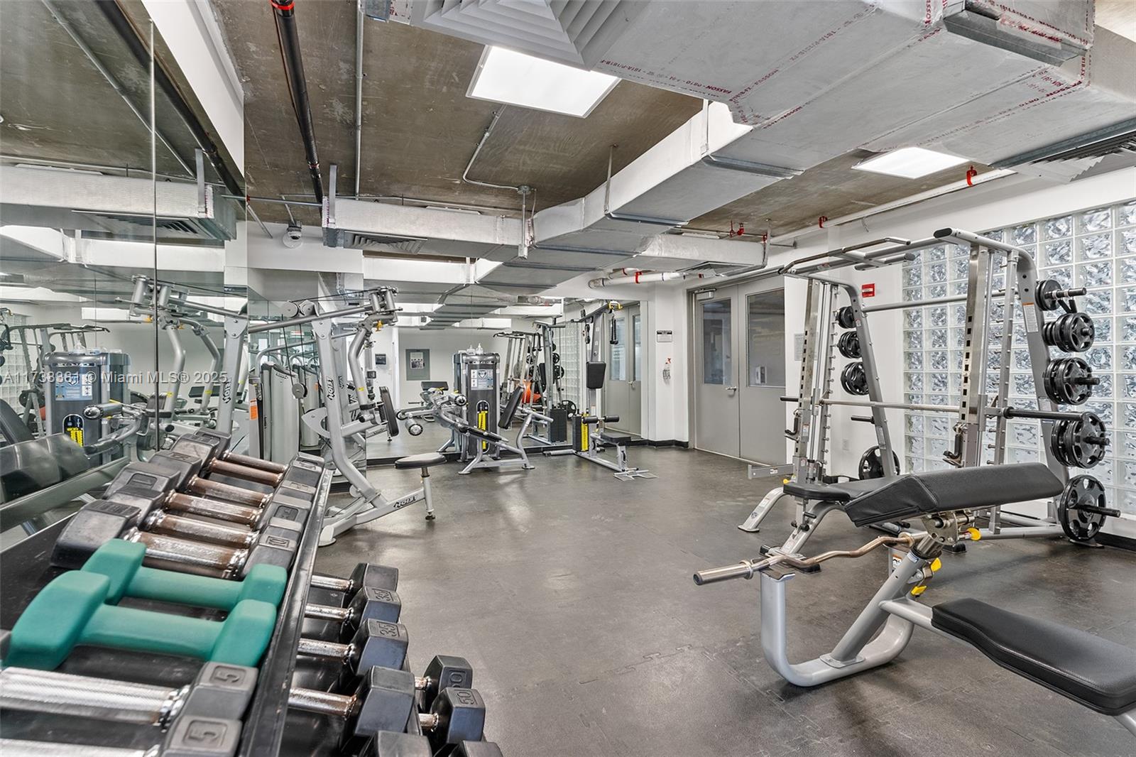 455 Northeast 25th Street, Unit 509 Miami, FL 33137 - Photo 21 of 30 a view of a room with gym equipment