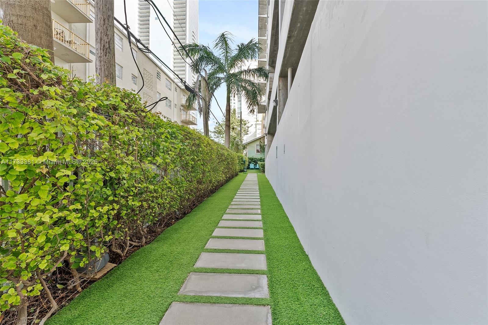 455 Northeast 25th Street, Unit 509 Miami, FL 33137 - Photo 23 of 30 a view of a yard with flower plants