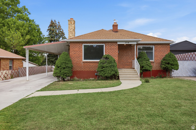 774 37th Street South Ogden, UT 84403 - Photo 2 of 47 Brick exterior featuring a gabled roof and stone chimney