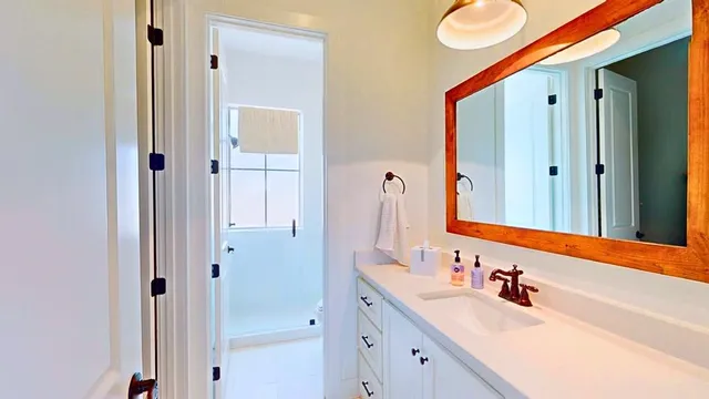 a bathroom with a double vanity sink and mirror