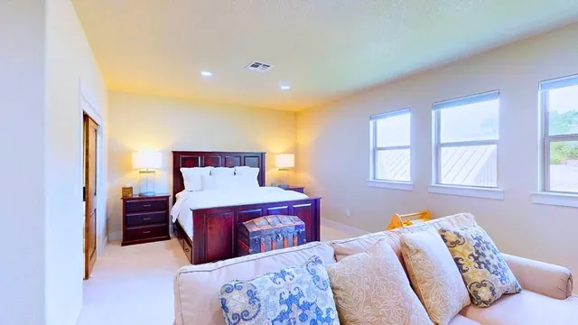 a bedroom with a bed and window