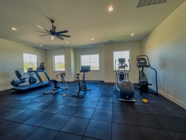 a living room with lots of furniture and a chandelier