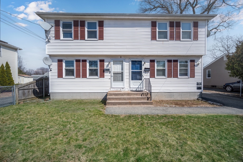 71 Price Street Springfield, MA 01104 - Photo 2 of 42 a front view of a house with a yard