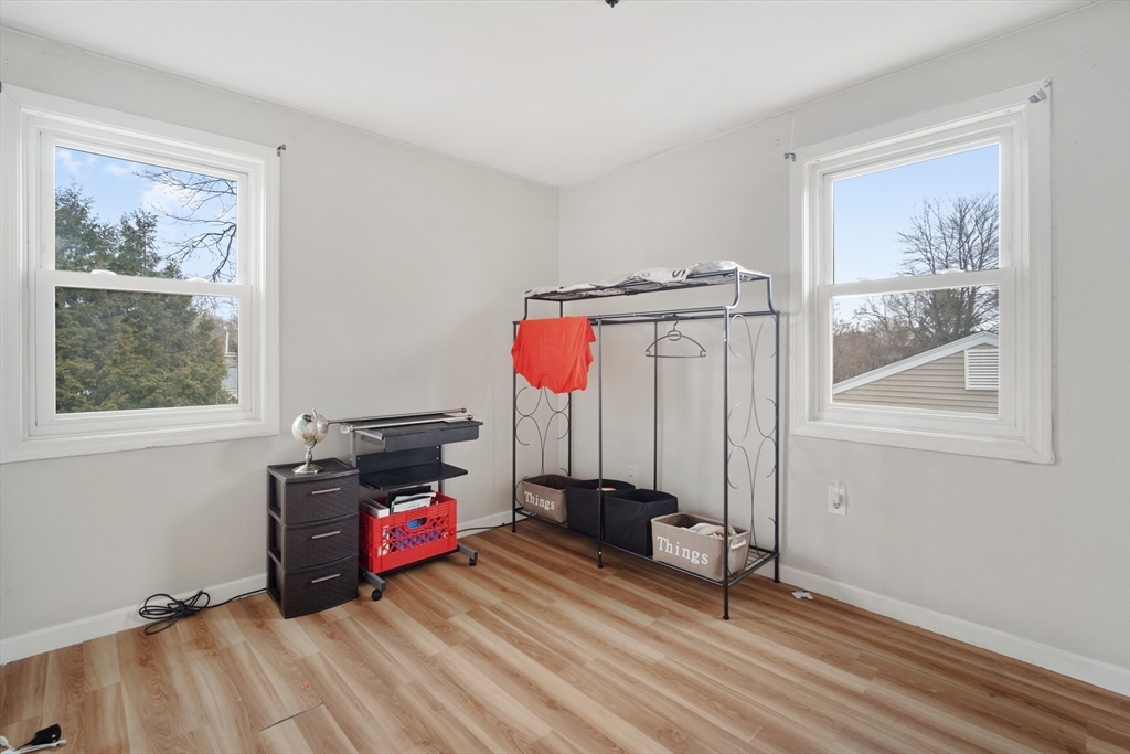 71 Price Street Springfield, MA 01104 - Photo 28 of 42 a view of a bedroom with furniture wooden floor and window