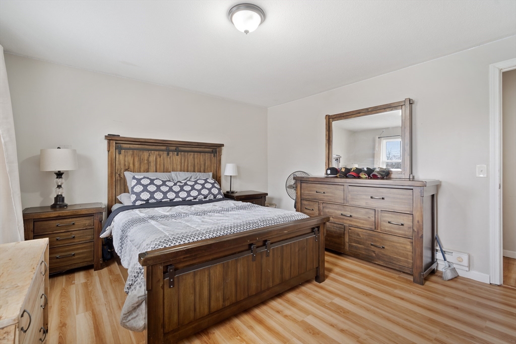 71 Price Street Springfield, MA 01104 - Photo 29 of 42 a bedroom with a bed and a dresser