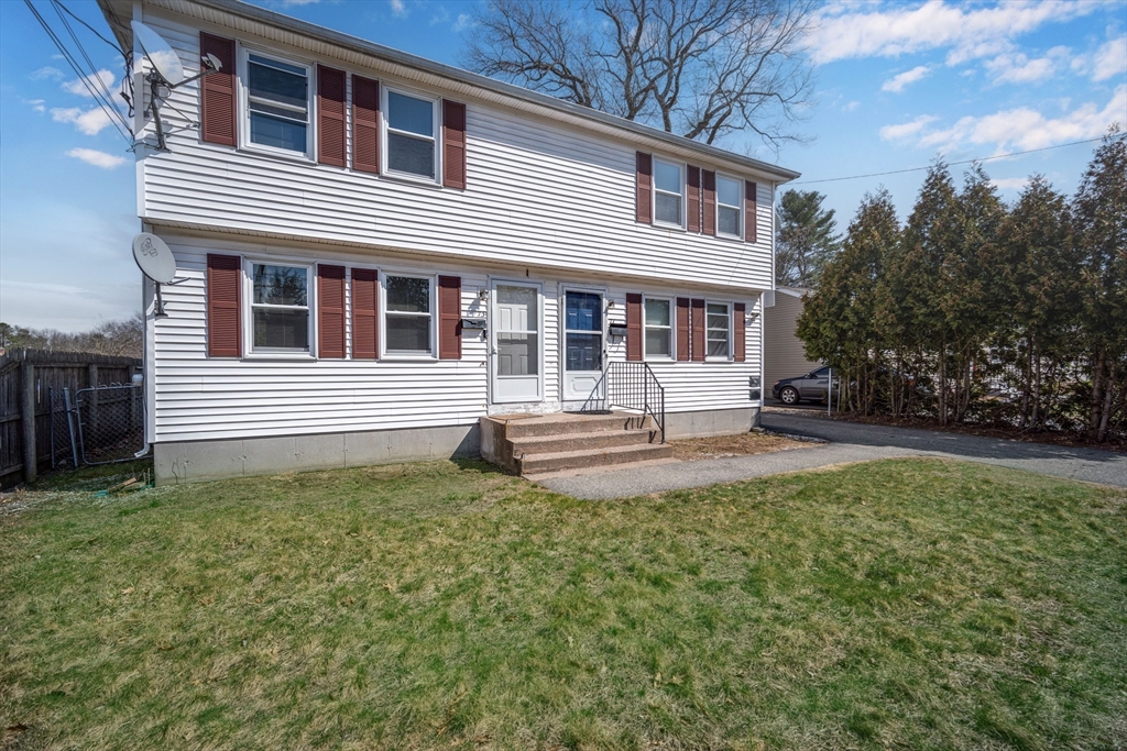 71 Price Street Springfield, MA 01104 - Photo 3 of 42 a front view of a house with a yard