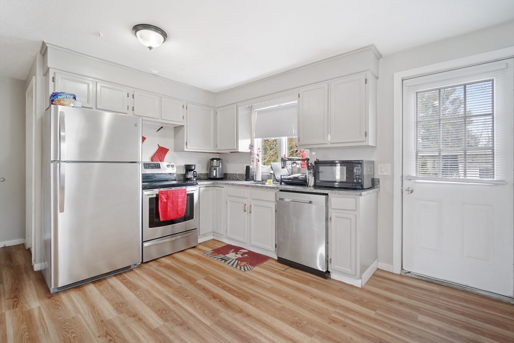 71 Price Street Springfield, MA 01104 - Photo 8 of 42 a kitchen with cabinets appliances and a window