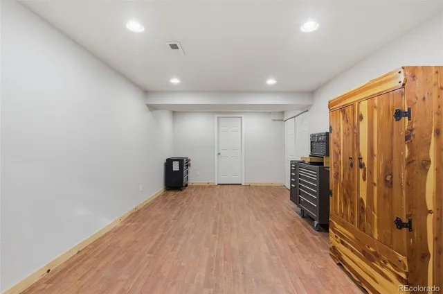 a view of a room with wooden floor and stairs