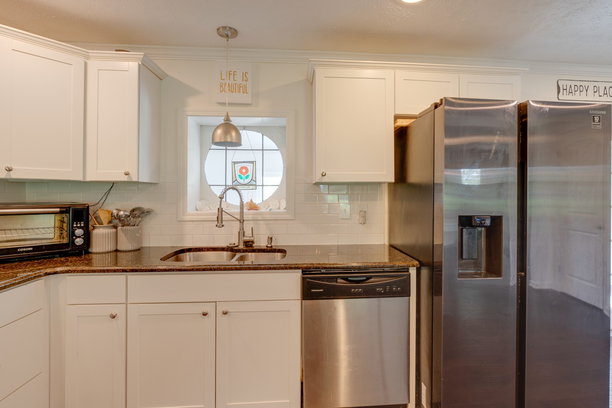 1765 Hayshed Road Charlotte, TN 37036 - Photo 14 of 34 a kitchen with a refrigerator and a sink