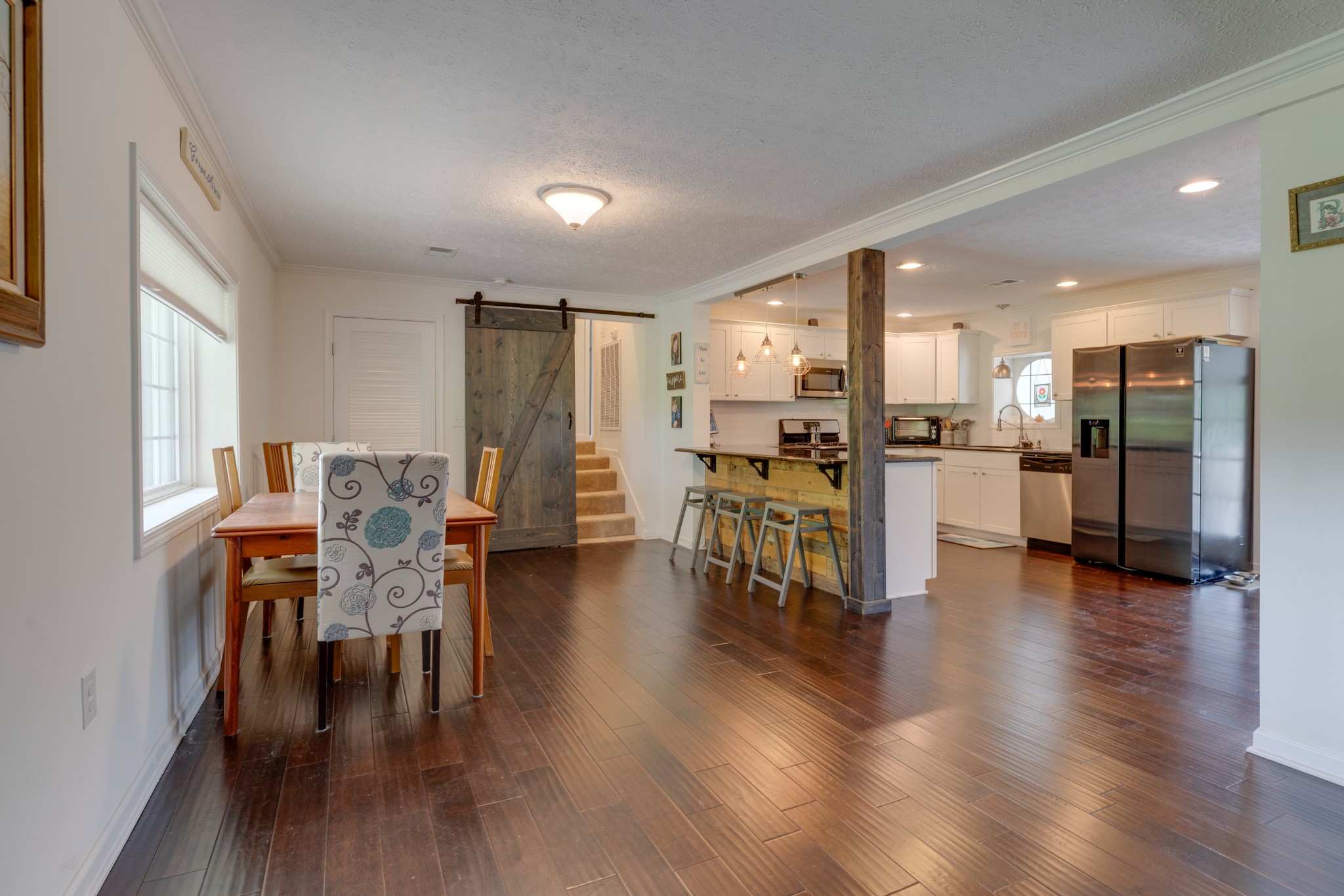 1765 Hayshed Road Charlotte, TN 37036 - Photo 15 of 34 a view of a dining room with furniture and wooden floor