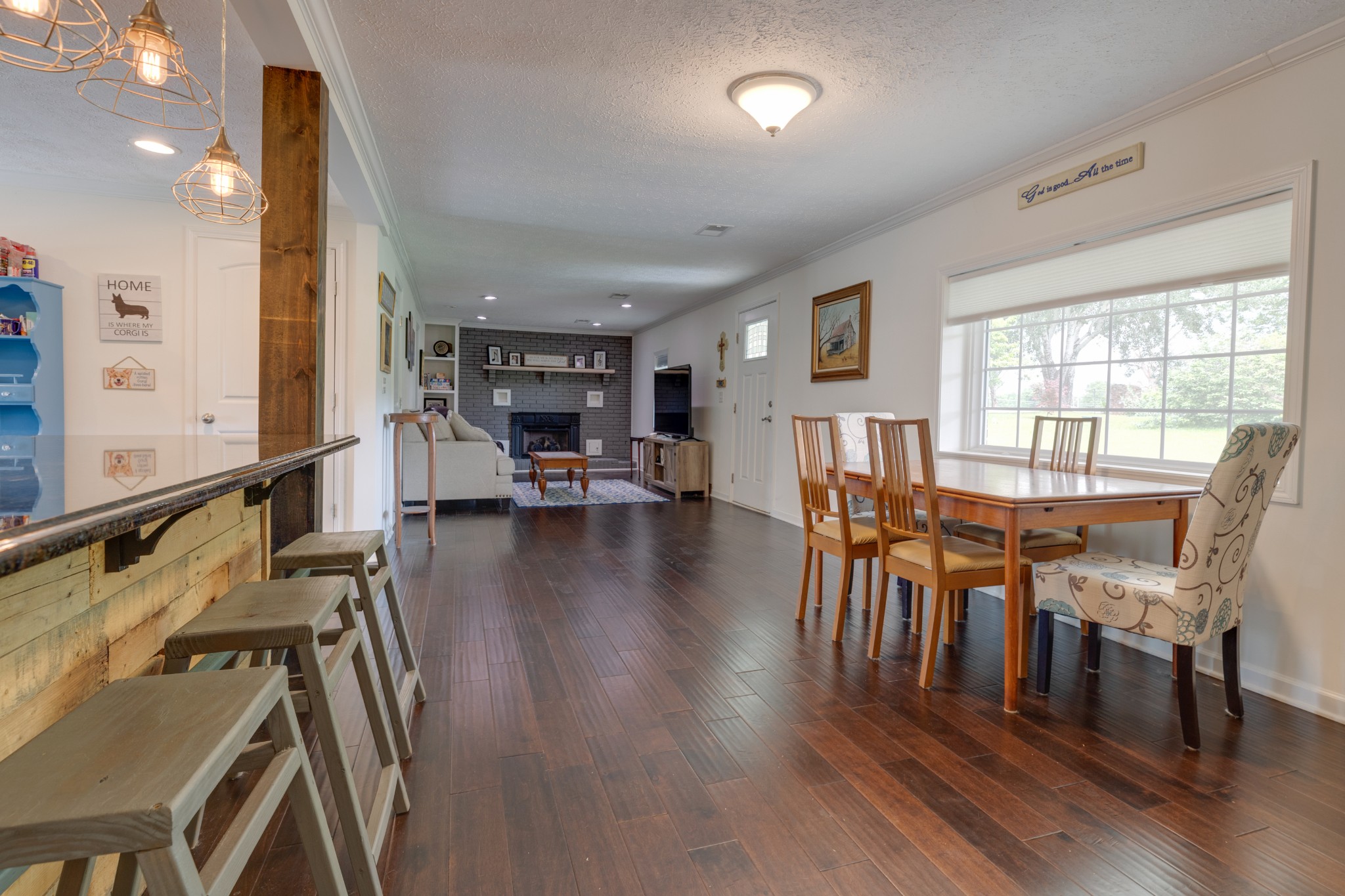 1765 Hayshed Road Charlotte, TN 37036 - Photo 16 of 34 a view of a dining room with furniture and wooden floor