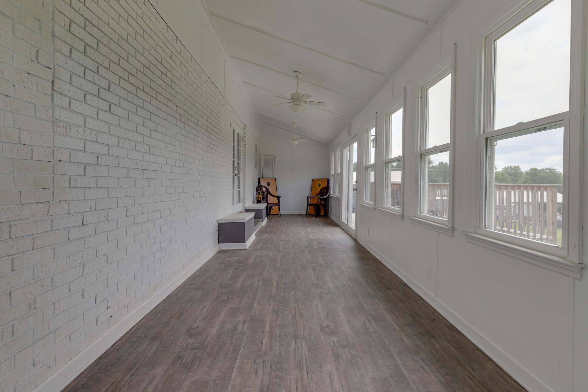 1765 Hayshed Road Charlotte, TN 37036 - Photo 32 of 34 a view of a hallway with wooden floor and a couch