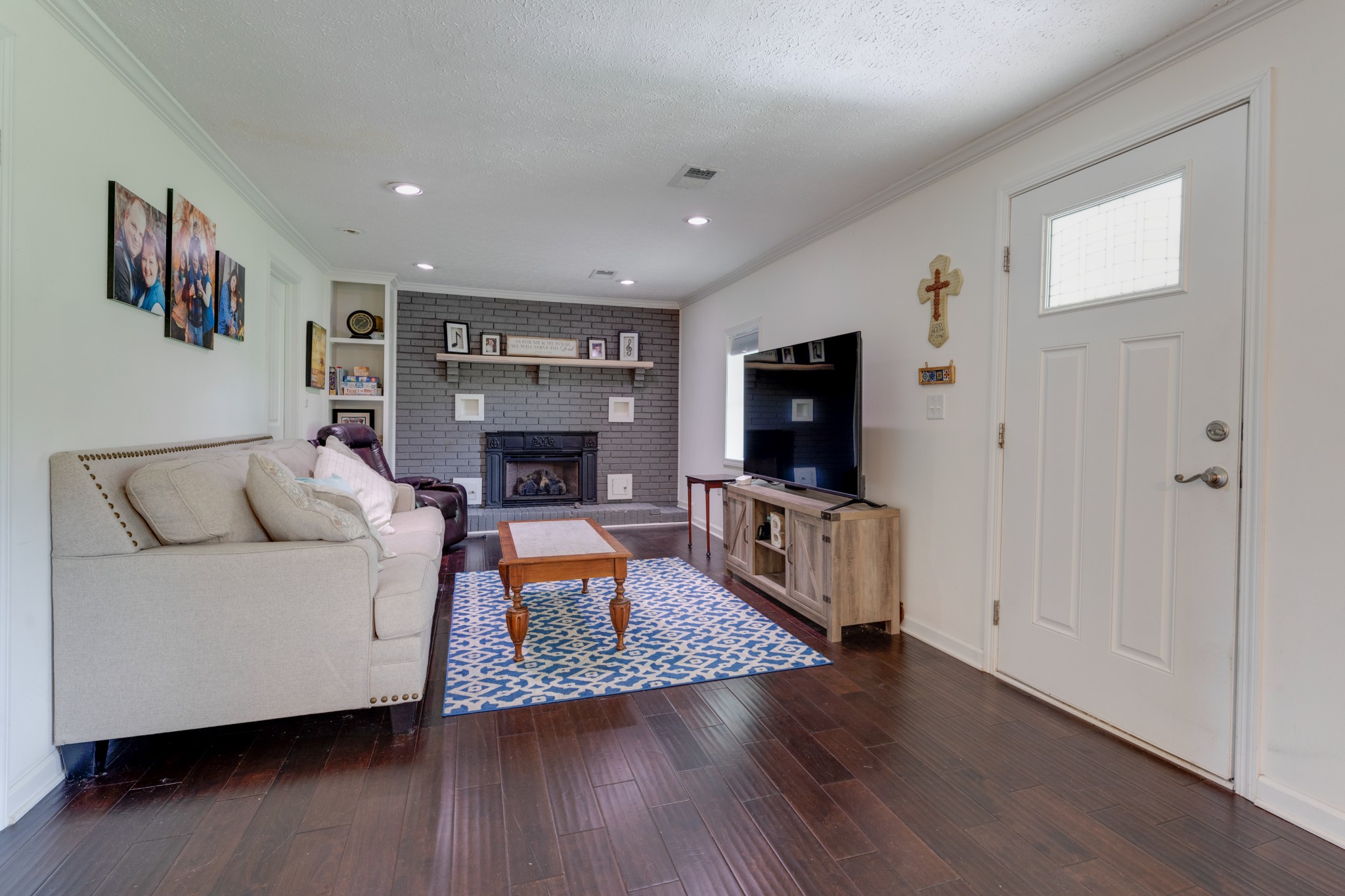 1765 Hayshed Road Charlotte, TN 37036 - Photo 10 of 34 a living room with furniture and a flat screen tv