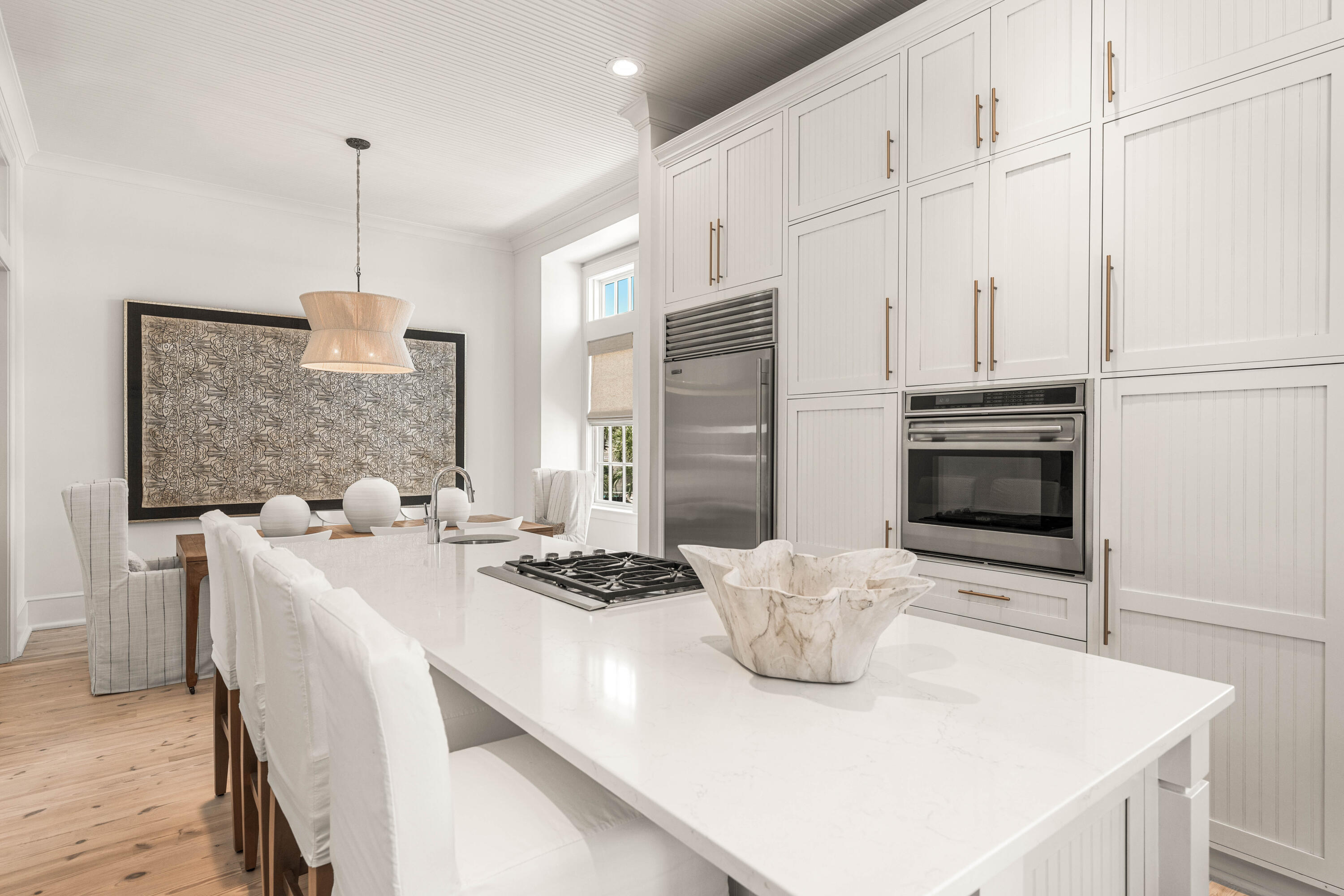 249 Lifeguard Loop East, Unit A3 Inlet Beach, FL 32461 - Photo 28 of 60 a kitchen with stainless steel appliances a stove a sink a refrigerator white cabinets and couches