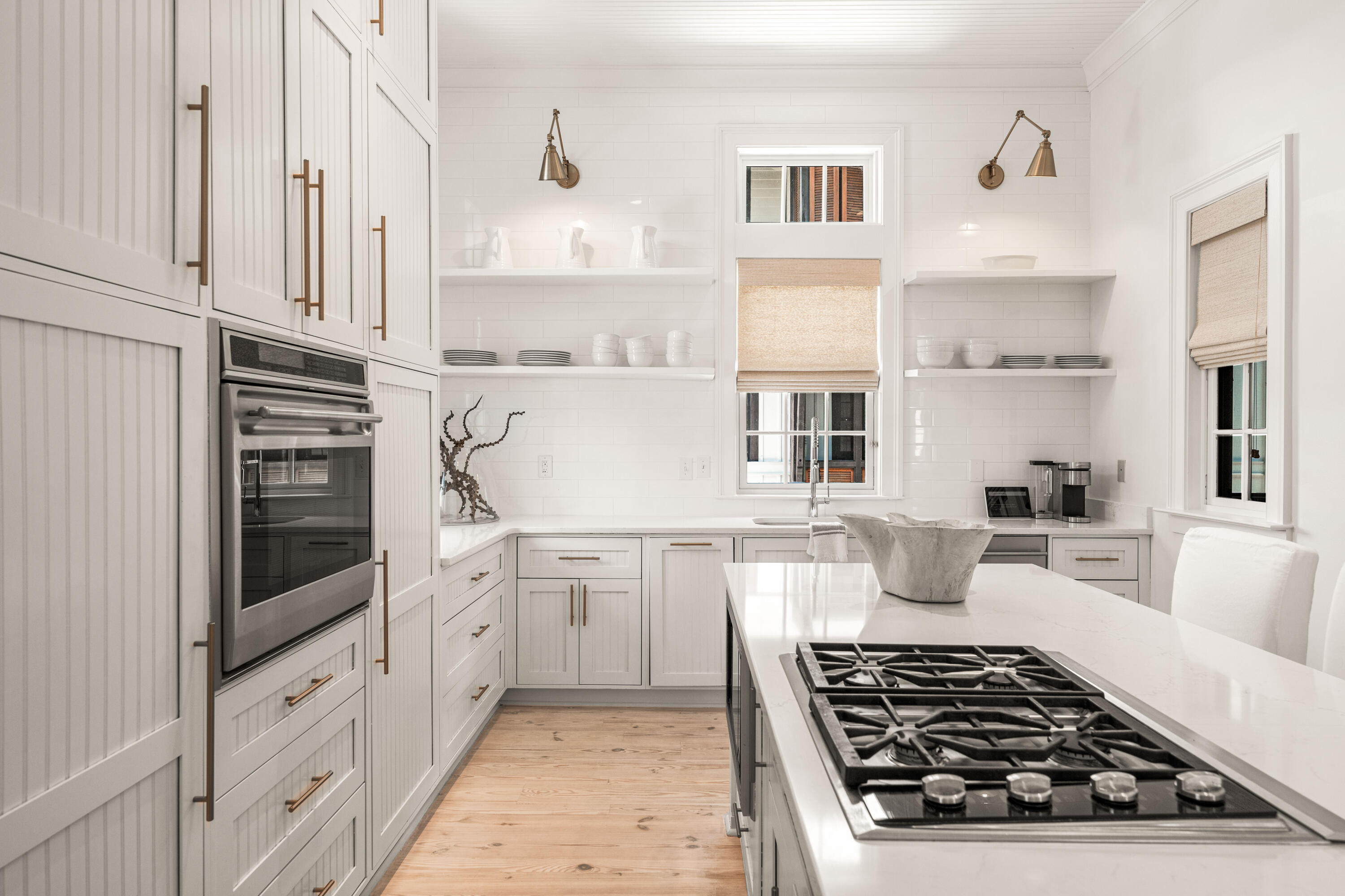 249 Lifeguard Loop East, Unit A3 Inlet Beach, FL 32461 - Photo 30 of 60 a kitchen with stainless steel appliances a white stove top oven and white cabinets