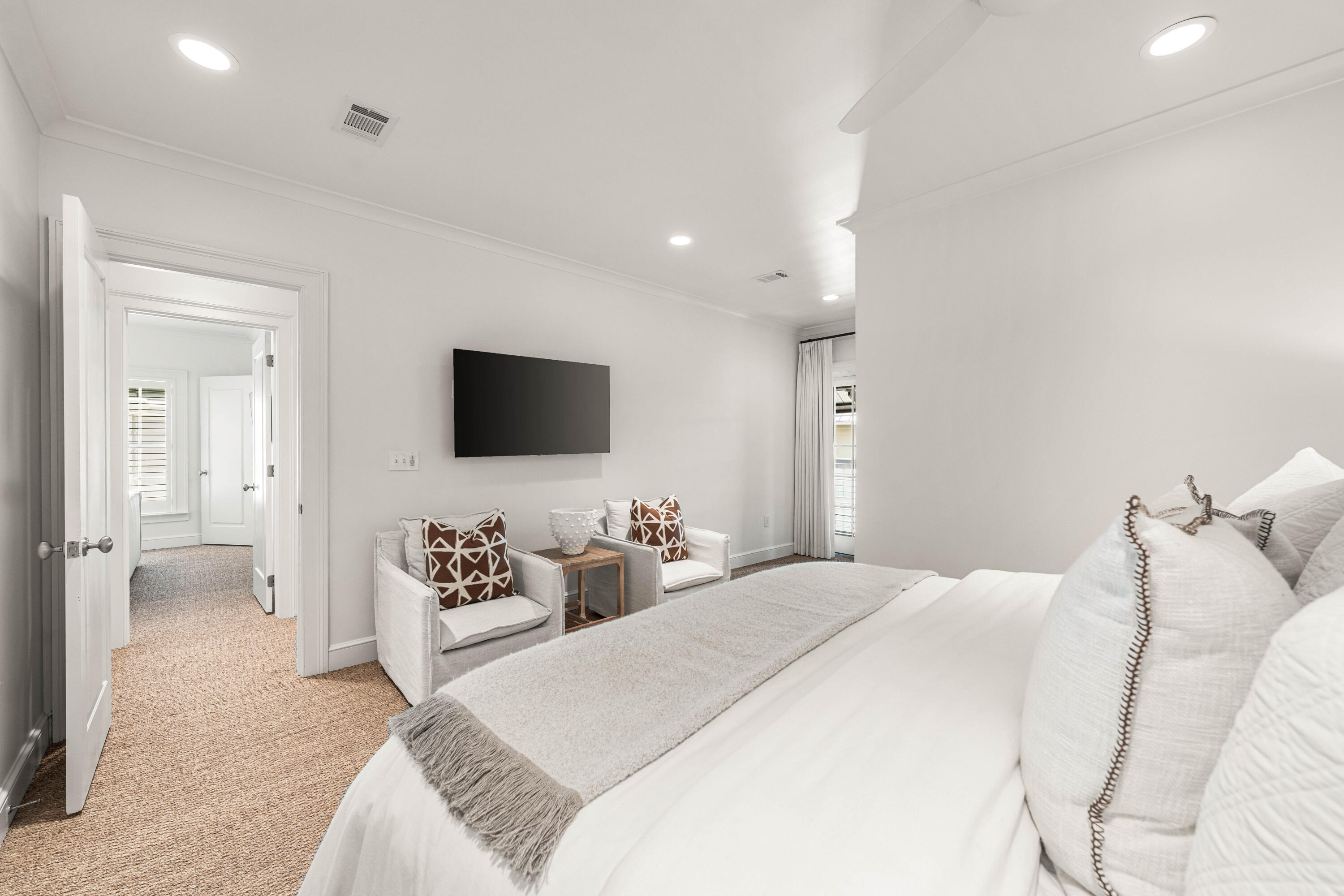 249 Lifeguard Loop East, Unit A3 Inlet Beach, FL 32461 - Photo 35 of 60 a bedroom with a bed and a flat screen tv