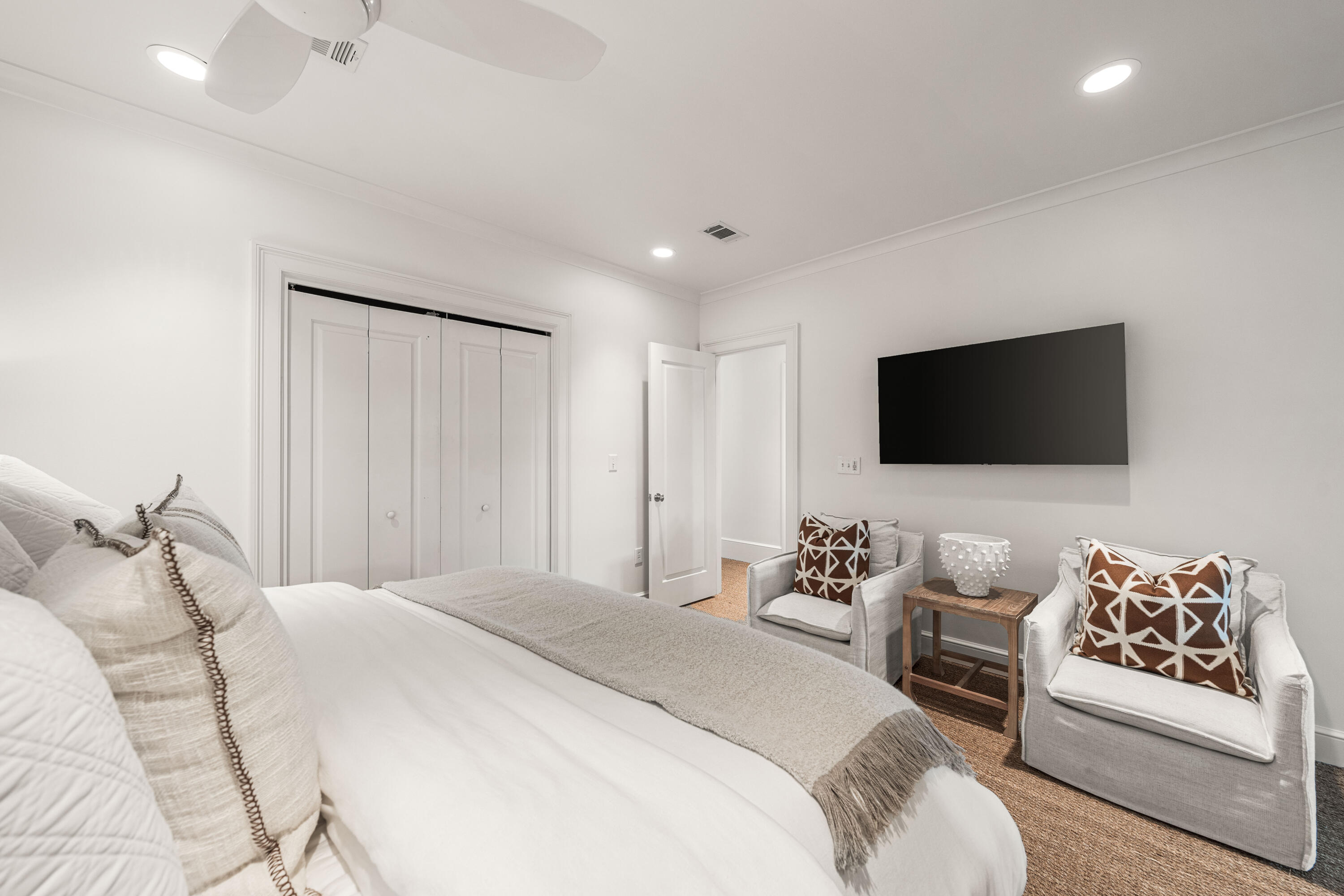 249 Lifeguard Loop East, Unit A3 Inlet Beach, FL 32461 - Photo 36 of 60 a bedroom with a bed a couch and a flat screen tv