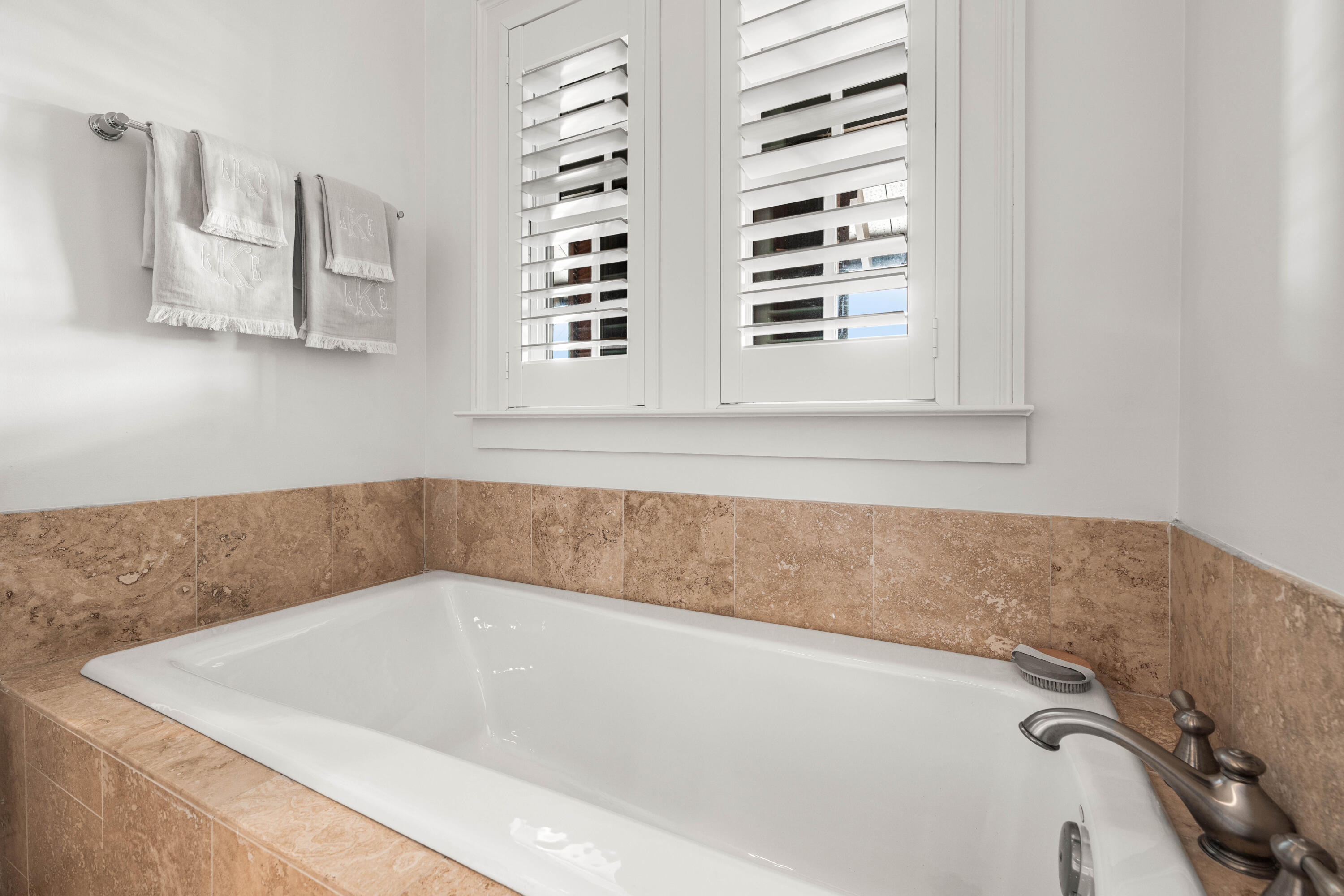 249 Lifeguard Loop East, Unit A3 Inlet Beach, FL 32461 - Photo 39 of 60 a bath tub sitting in a bathroom next to a window