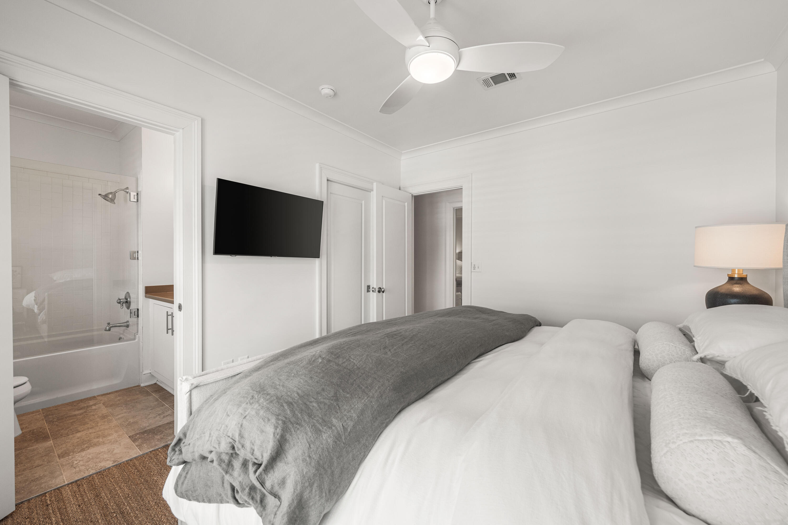 249 Lifeguard Loop East, Unit A3 Inlet Beach, FL 32461 - Photo 41 of 60 a spacious bedroom with a bed and a flat screen tv