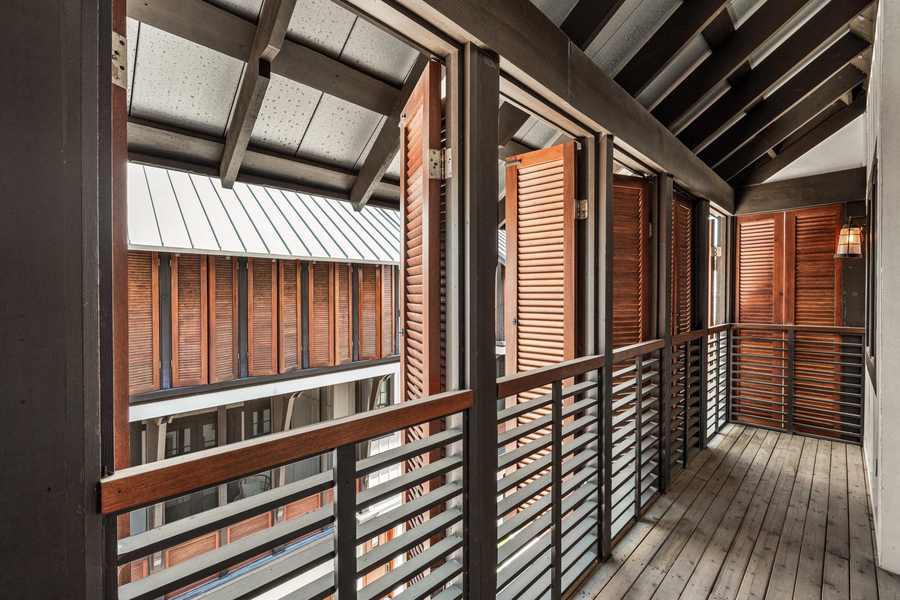 249 Lifeguard Loop East, Unit A3 Inlet Beach, FL 32461 - Photo 47 of 60 a view of a balcony with wooden floor