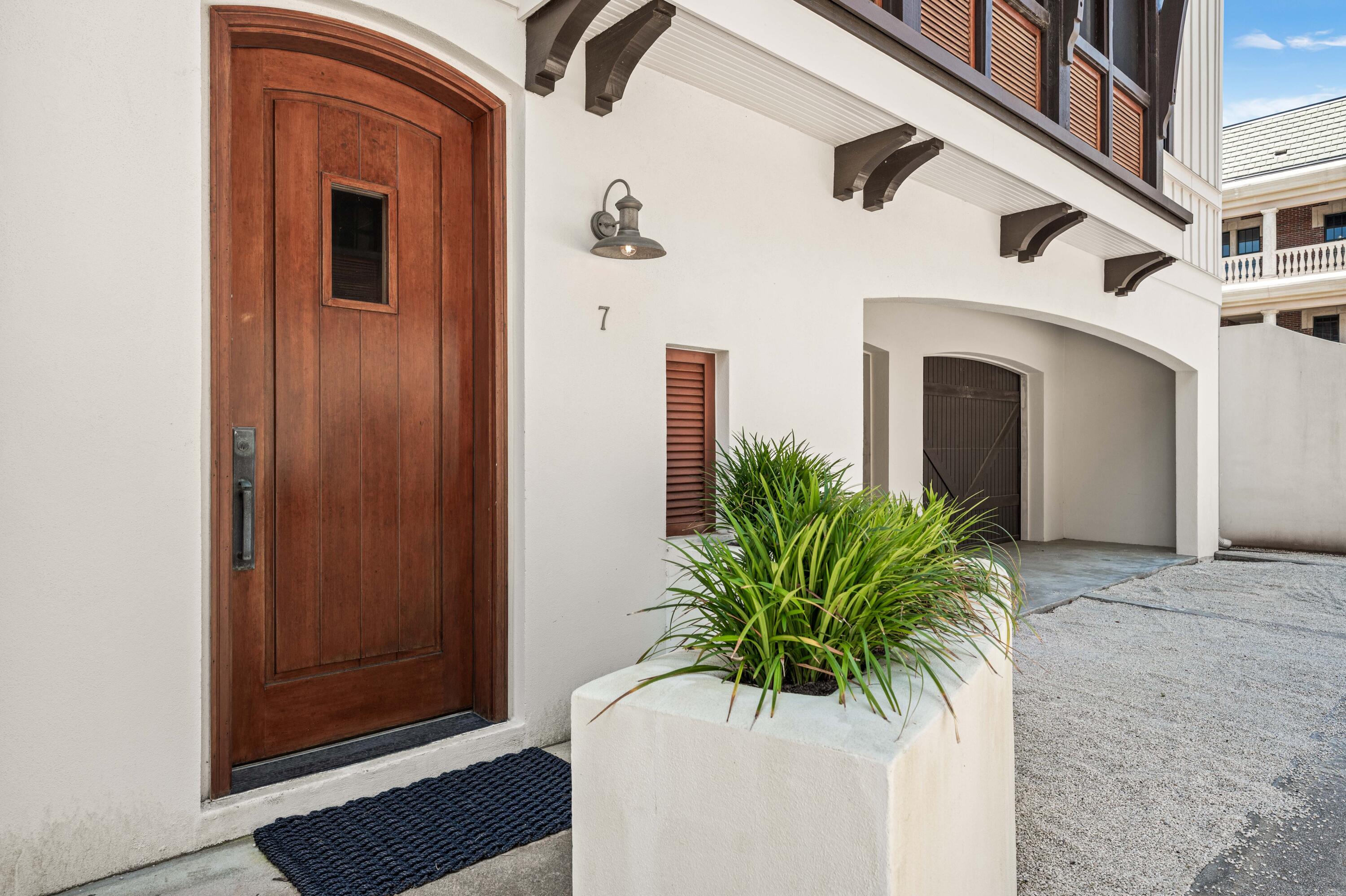 249 Lifeguard Loop East, Unit A3 Inlet Beach, FL 32461 - Photo 9 of 60 a potted plant sitting in front of a door