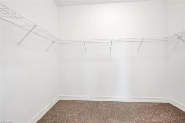 a view of an empty room with a bathroom