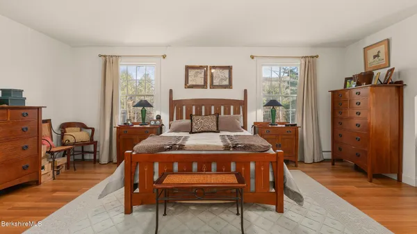 a bed room with a bed and a dresser