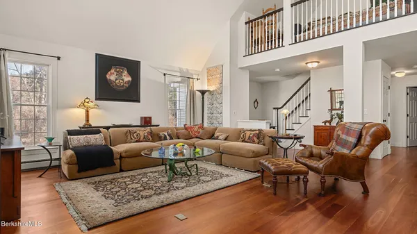 a living room with furniture and a rug