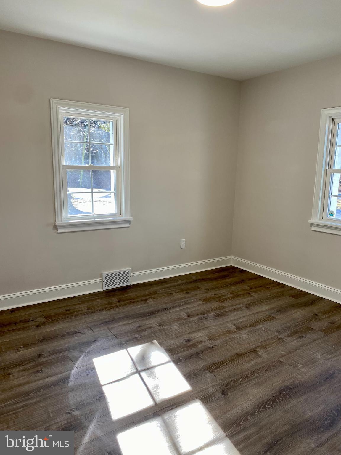 1297 Highway 40 Pilesgrove, NJ 08098 - Photo 23 of 32 a view of a room with wooden floor and window