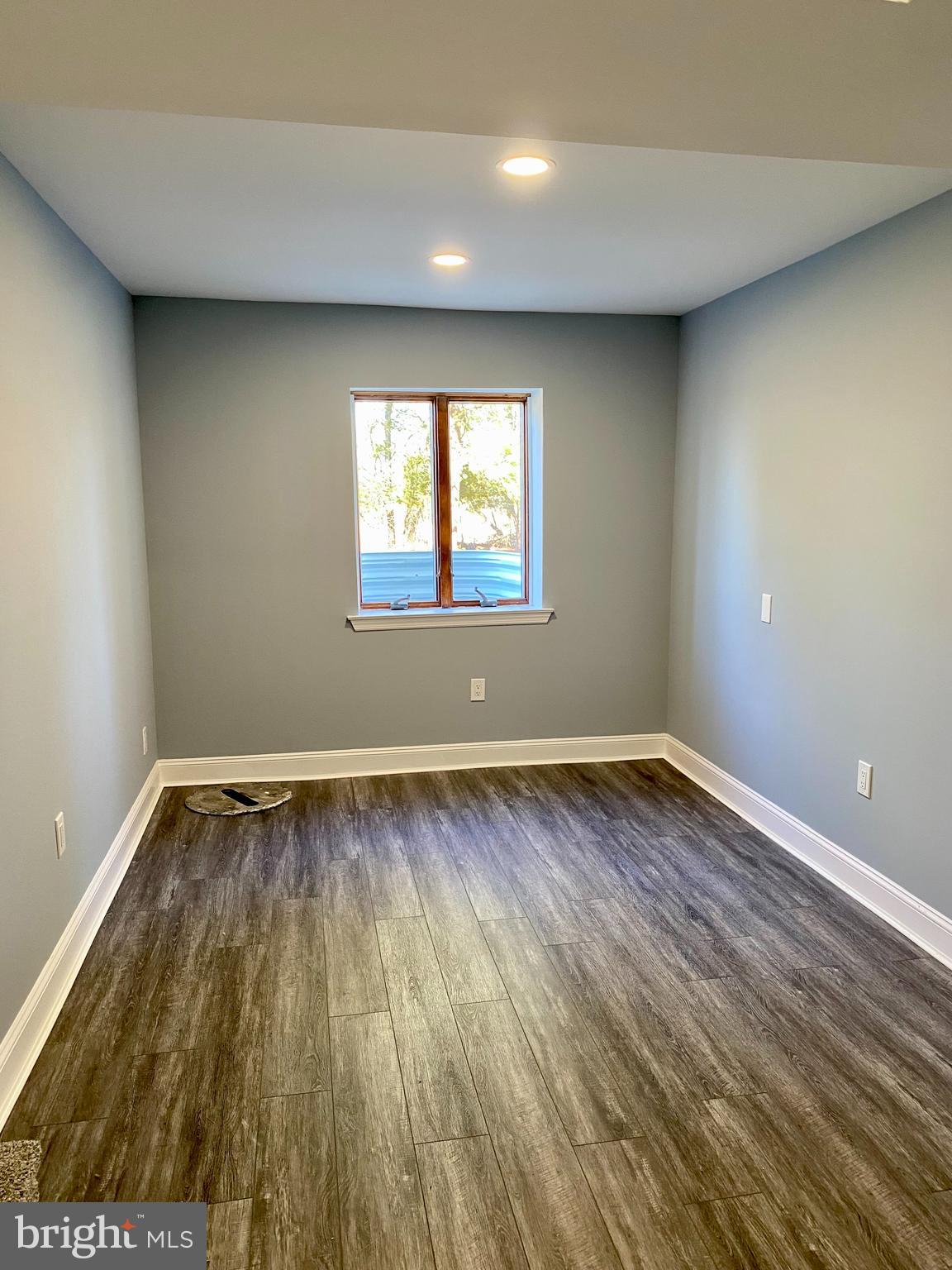 1297 Highway 40 Pilesgrove, NJ 08098 - Photo 24 of 32 wooden floor in an empty room with a window