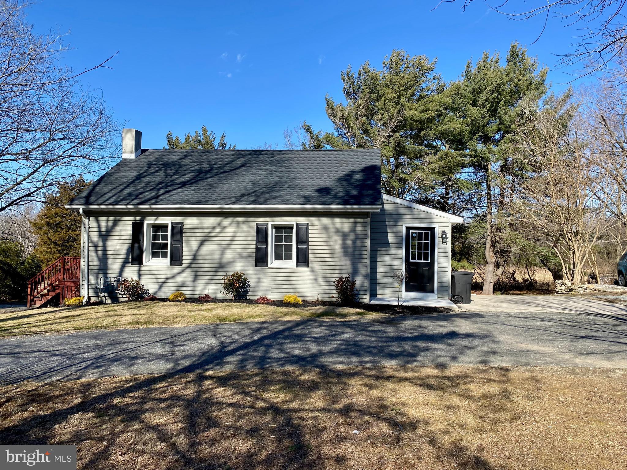 1297 Highway 40 Pilesgrove, NJ 08098 - Photo 3 of 32 a view of a house with a patio
