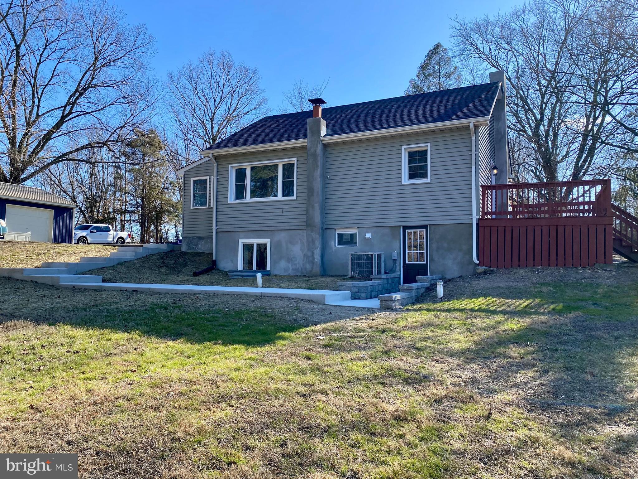 1297 Highway 40 Pilesgrove, NJ 08098 - Photo 5 of 32 a view of a house with a yard