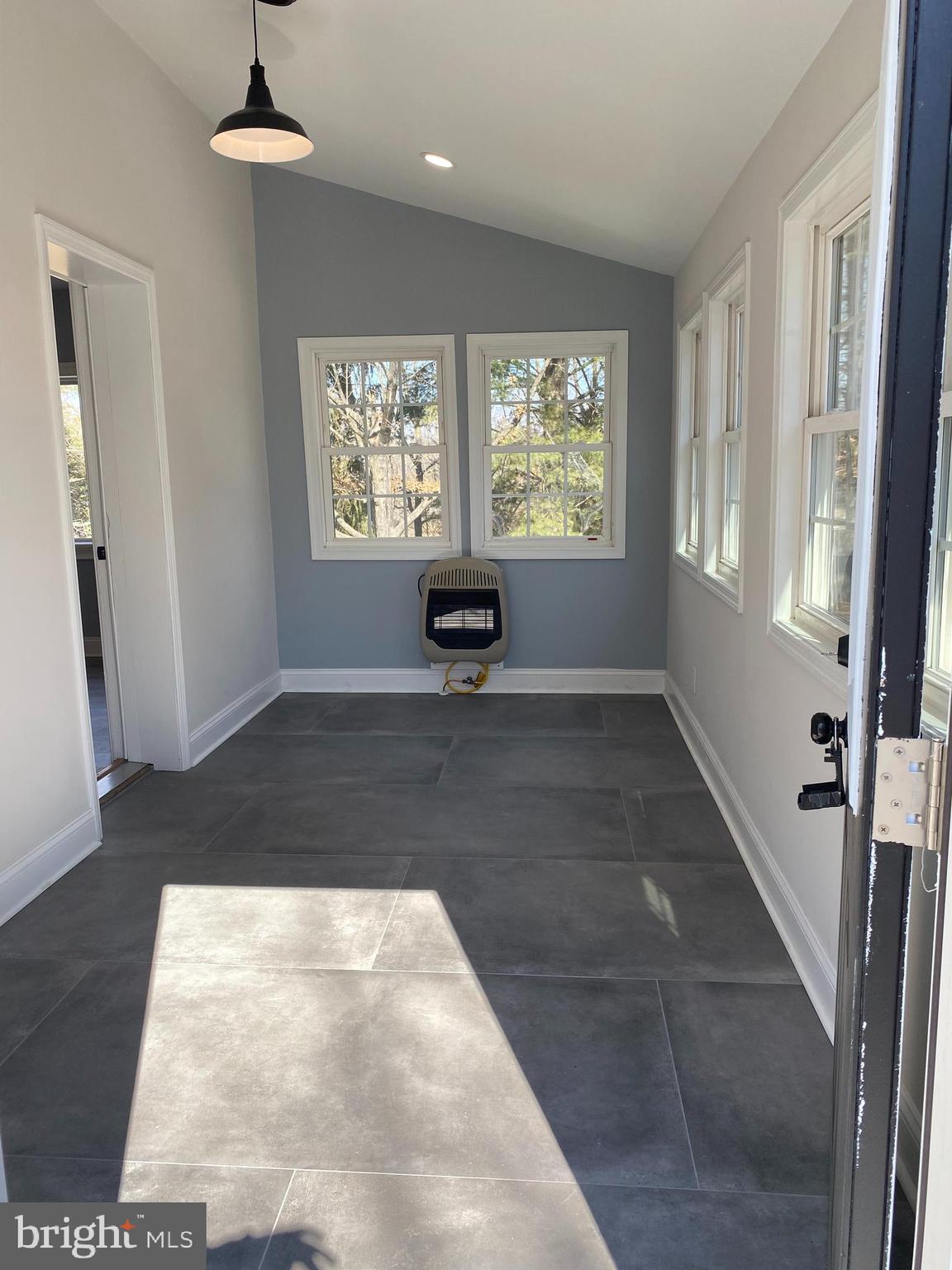 1297 Highway 40 Pilesgrove, NJ 08098 - Photo 6 of 32 wooden floor in an empty room with a window