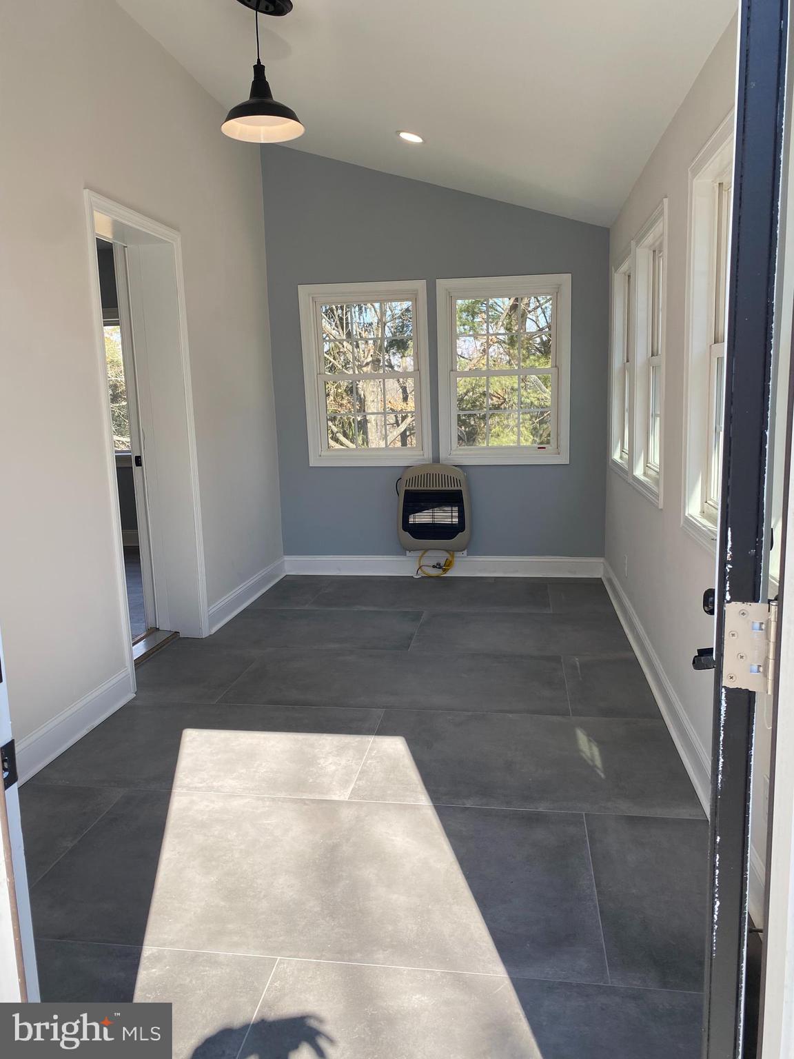 1297 Highway 40 Pilesgrove, NJ 08098 - Photo 7 of 32 a view of an empty room with a window