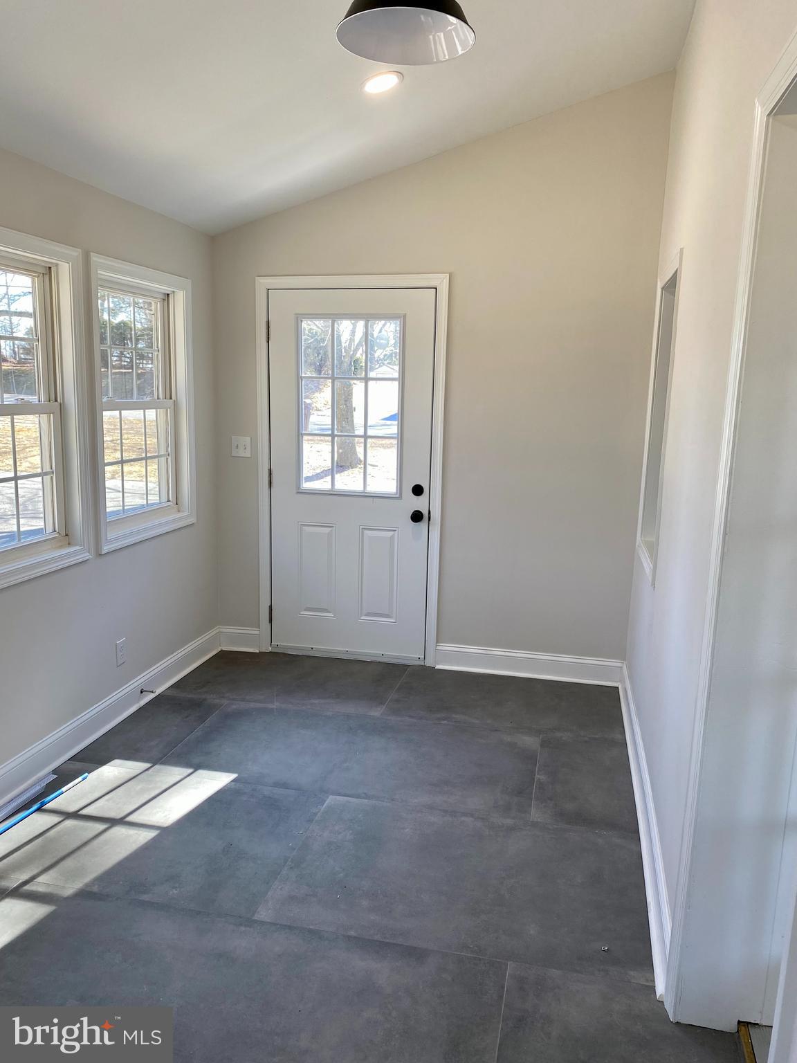 1297 Highway 40 Pilesgrove, NJ 08098 - Photo 8 of 32 an empty room with windows