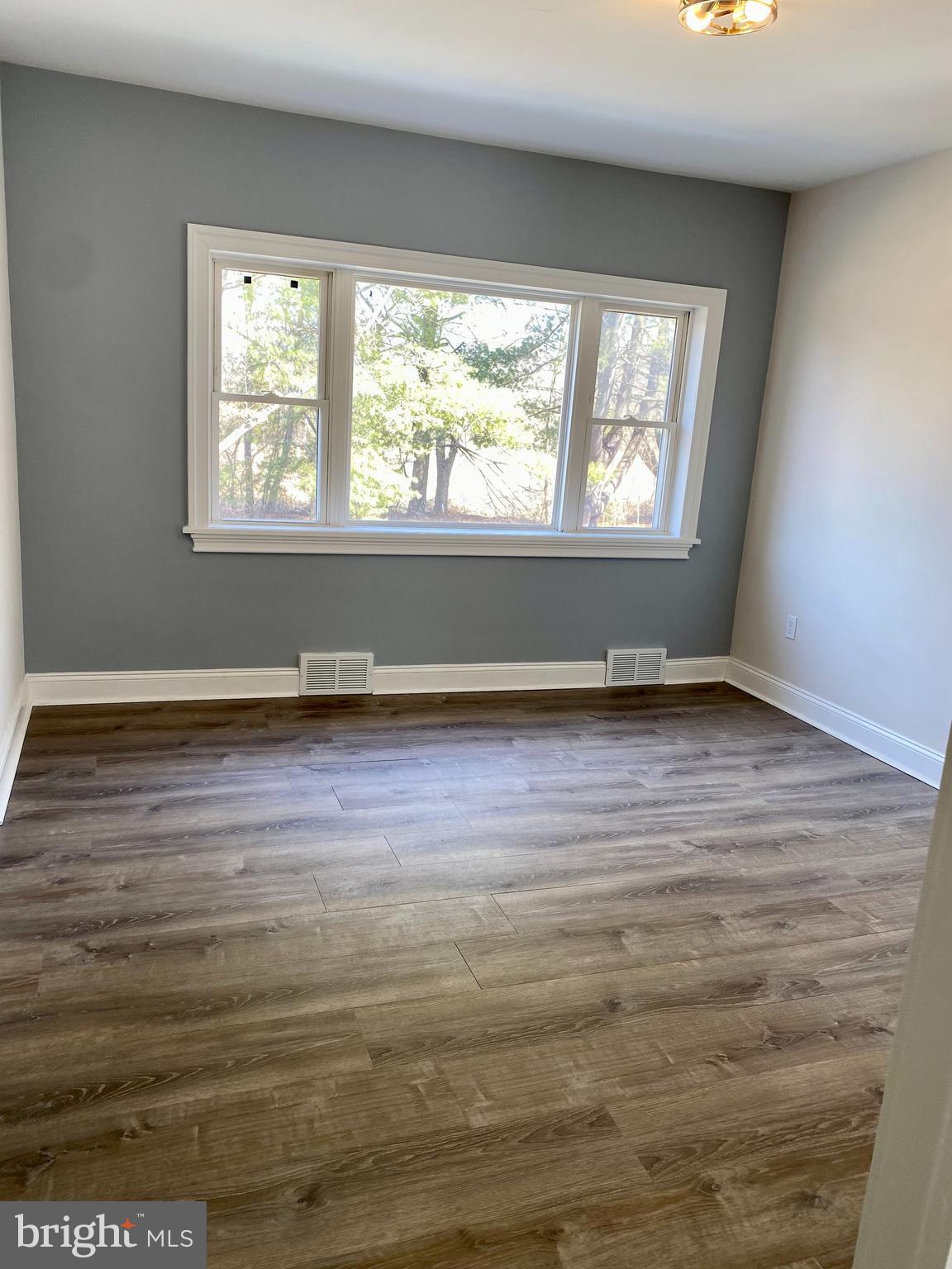 1297 Highway 40 Pilesgrove, NJ 08098 - Photo 10 of 32 a view of room with window and hardwood floor