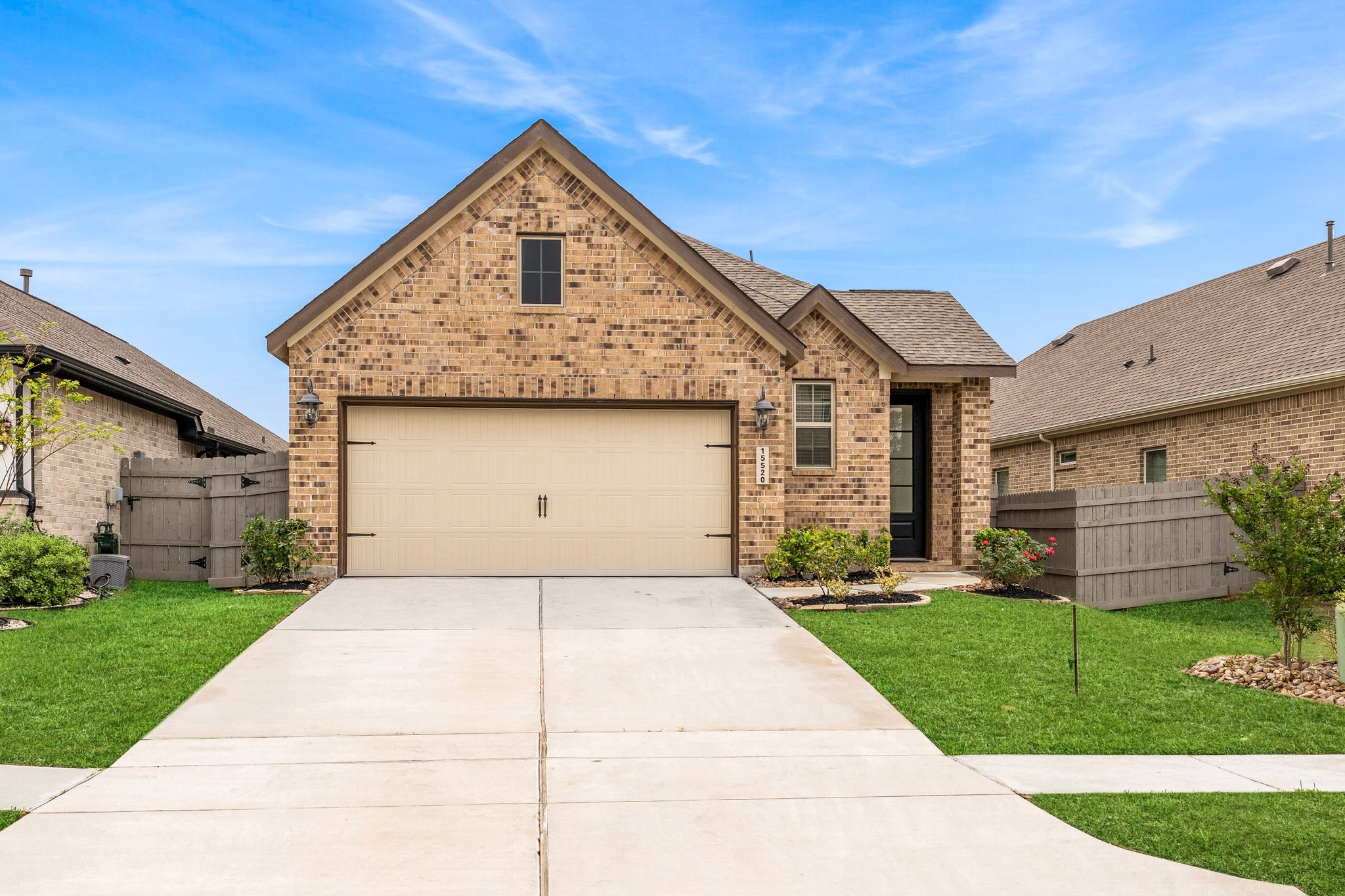 15520 Sunset Maple Court Conroe, TX 77302 - Photo 2 of 46 a front view of a house with a yard
