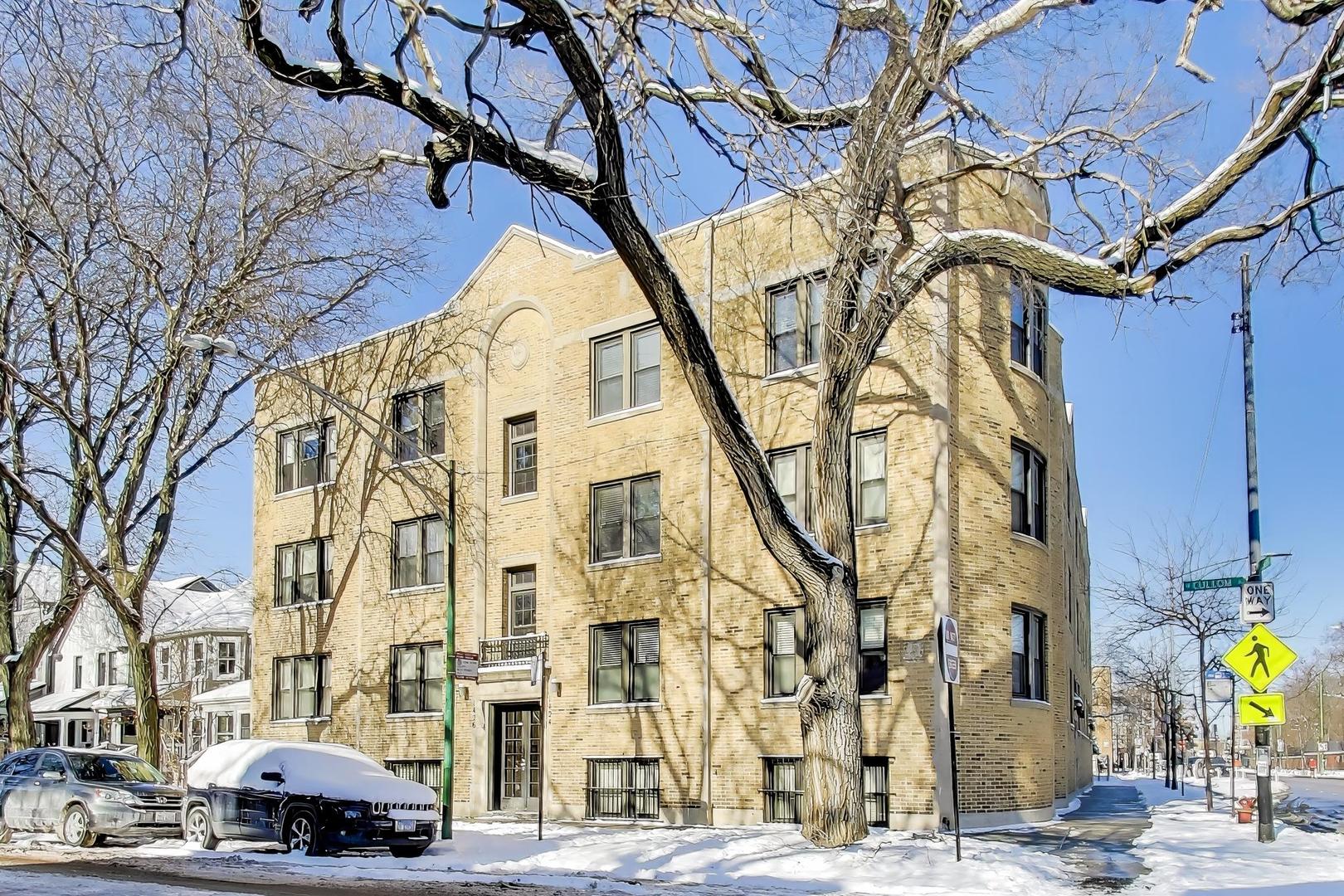1424 West Cullom Avenue, Unit 3 Chicago, IL 60613 - Photo 1 of 18 a front view of a building with large trees