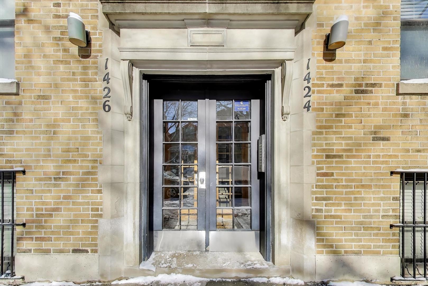 1424 West Cullom Avenue, Unit 3 Chicago, IL 60613 - Photo 3 of 18 a front view of a building with a door