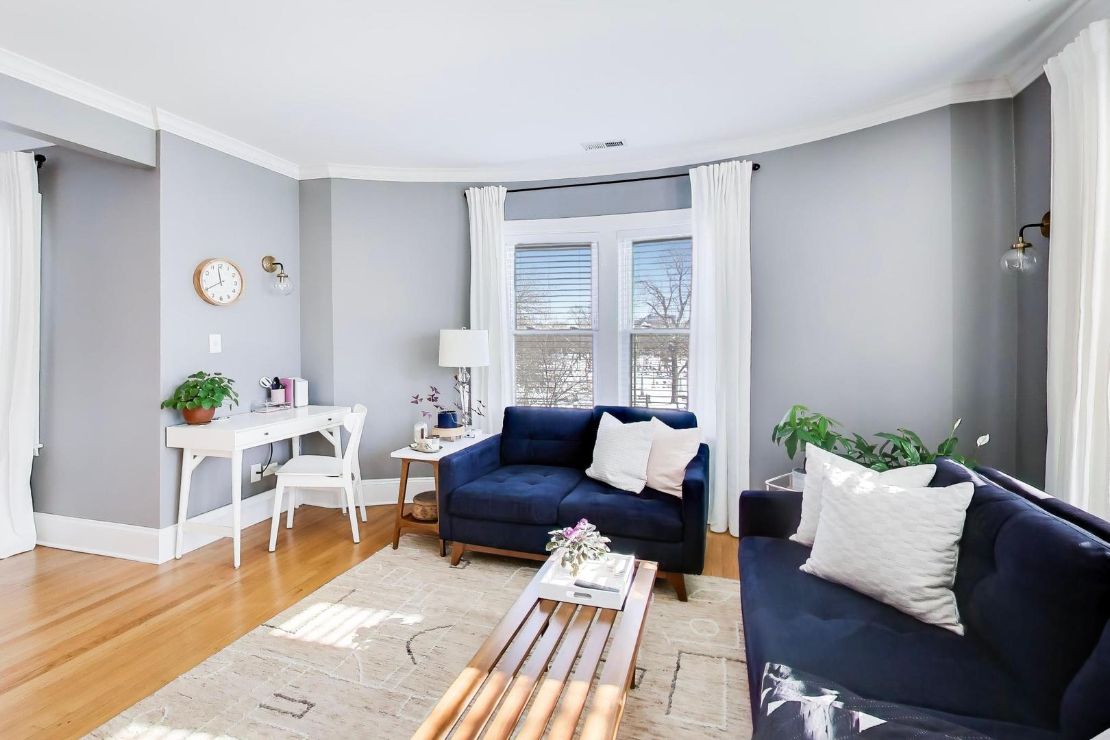 1424 West Cullom Avenue, Unit 3 Chicago, IL 60613 - Photo 6 of 18 a living room with furniture and wooden floor