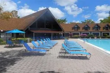 a view of house with outdoor seating area