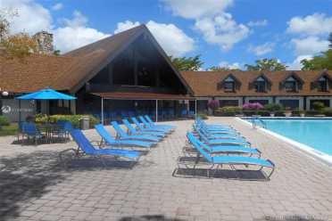 a view of house with outdoor seating area