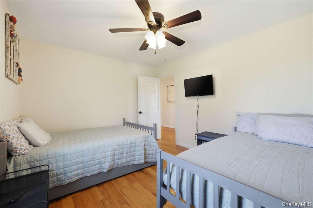 133 Old Chester Road Goshen, NY 10924 - Photo 20 of 33 a bedroom with two beds and a chandelier