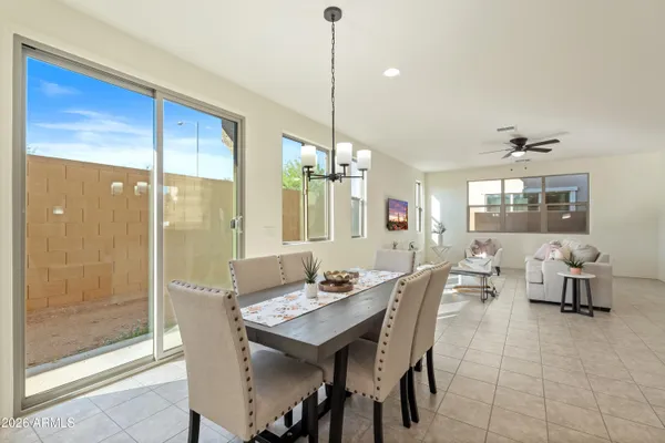 a dining room with furniture and window