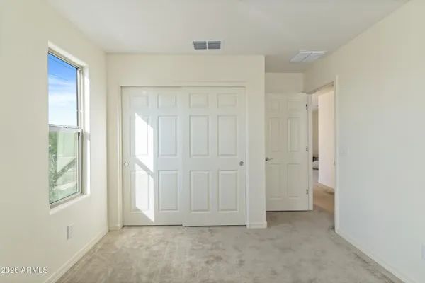 a work room with furniture and a flat screen tv